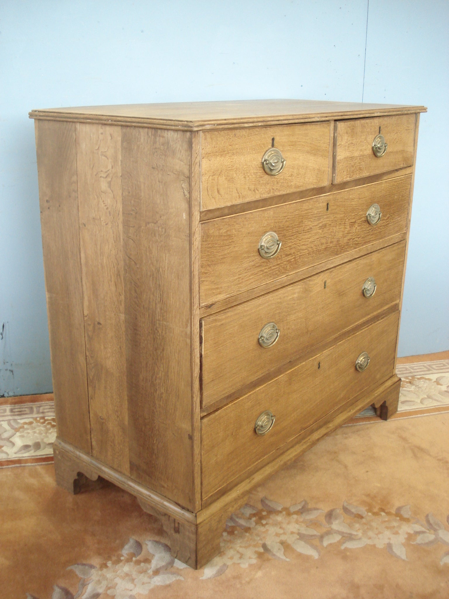 Circa 1830 Cross banded blonde oak five drawer chest
