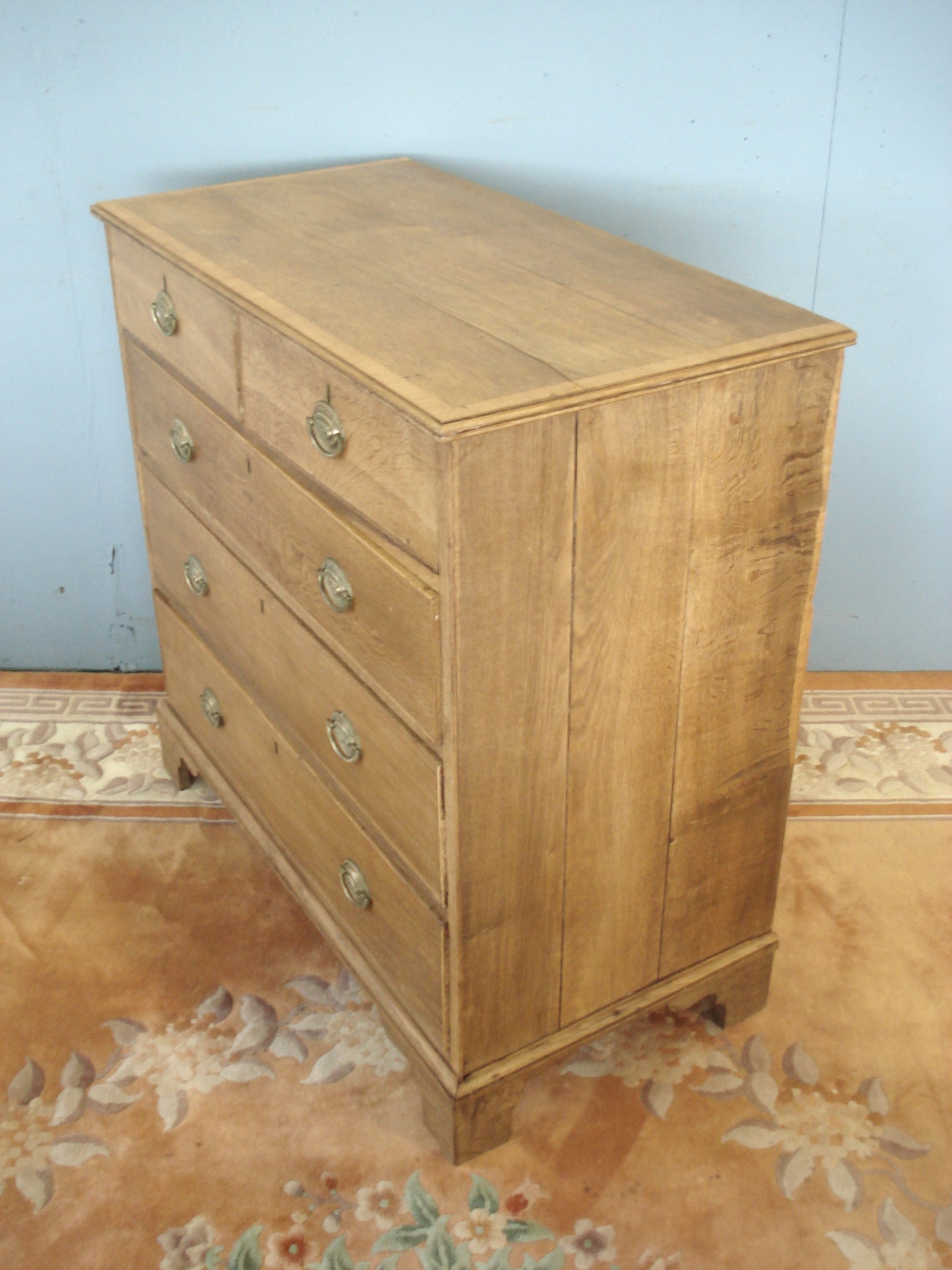 Circa 1830 Cross banded blonde oak five drawer chest