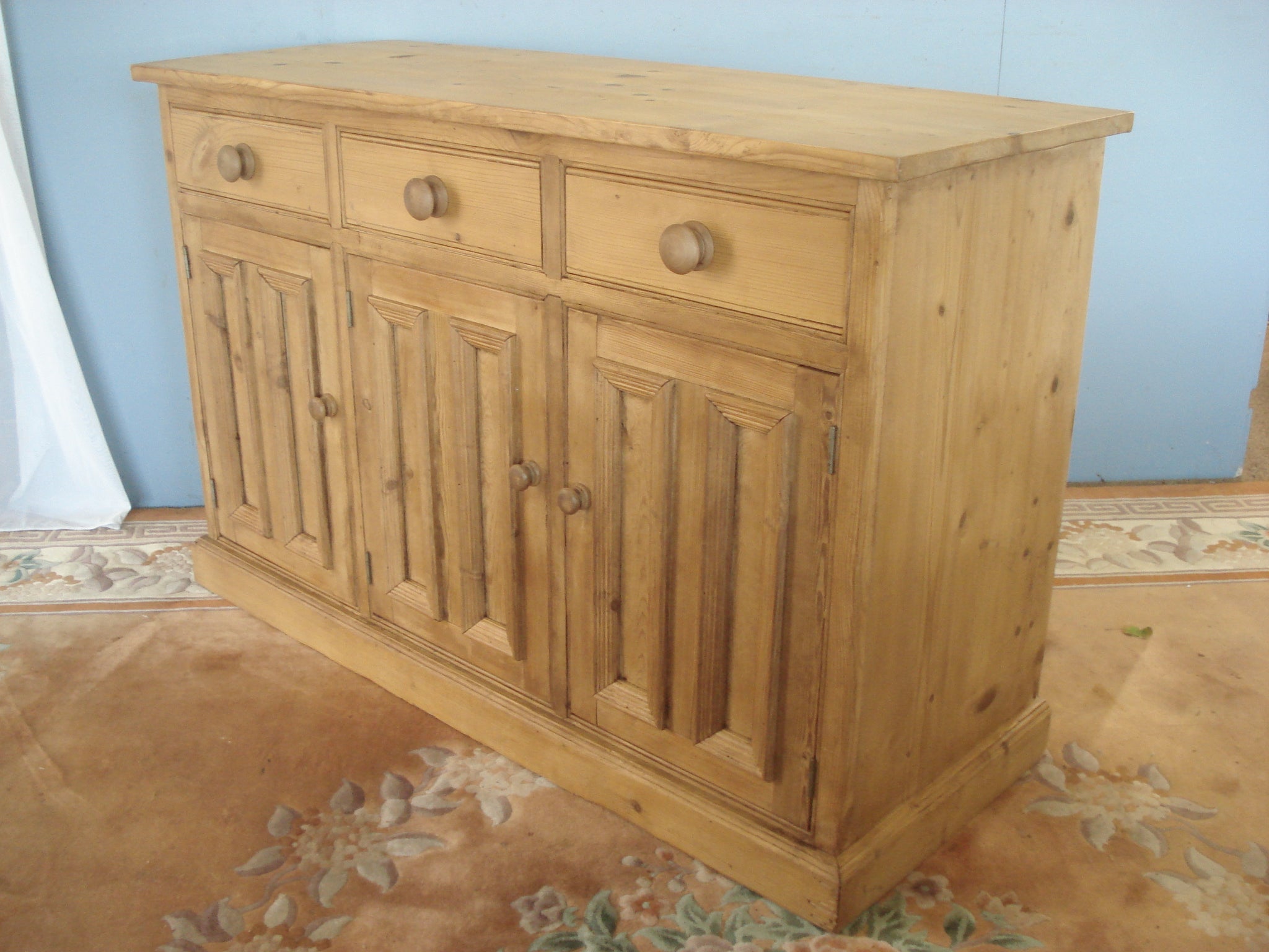 Stripped pine three drawer dresser base