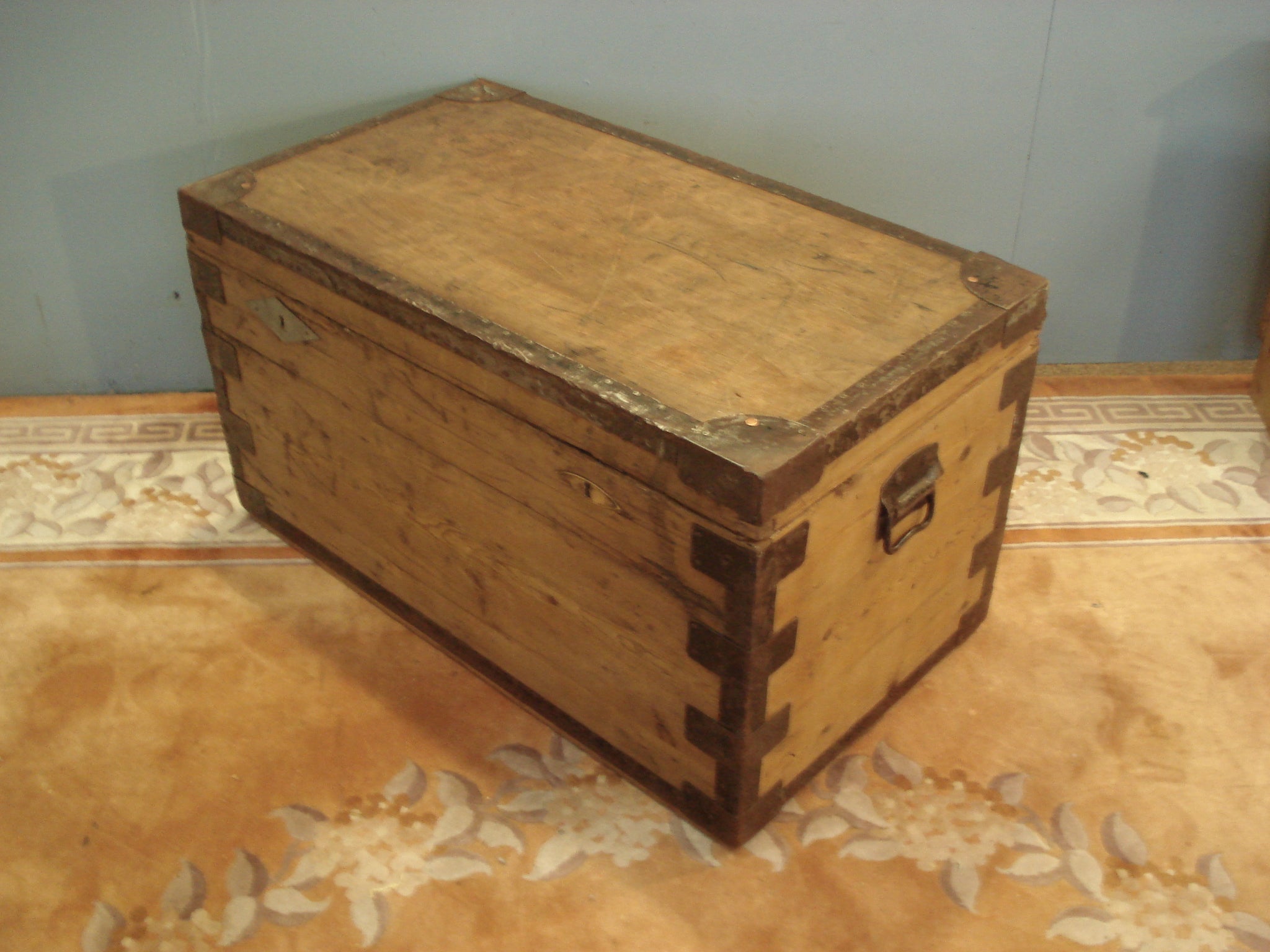 Battered old storage trunk. Zinc lined and with metal banding