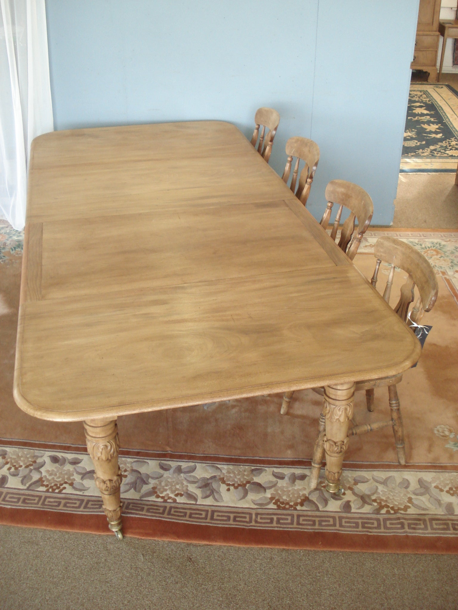 Extending Regency Blonde Mahogany table. 51" wide by 113" long max.