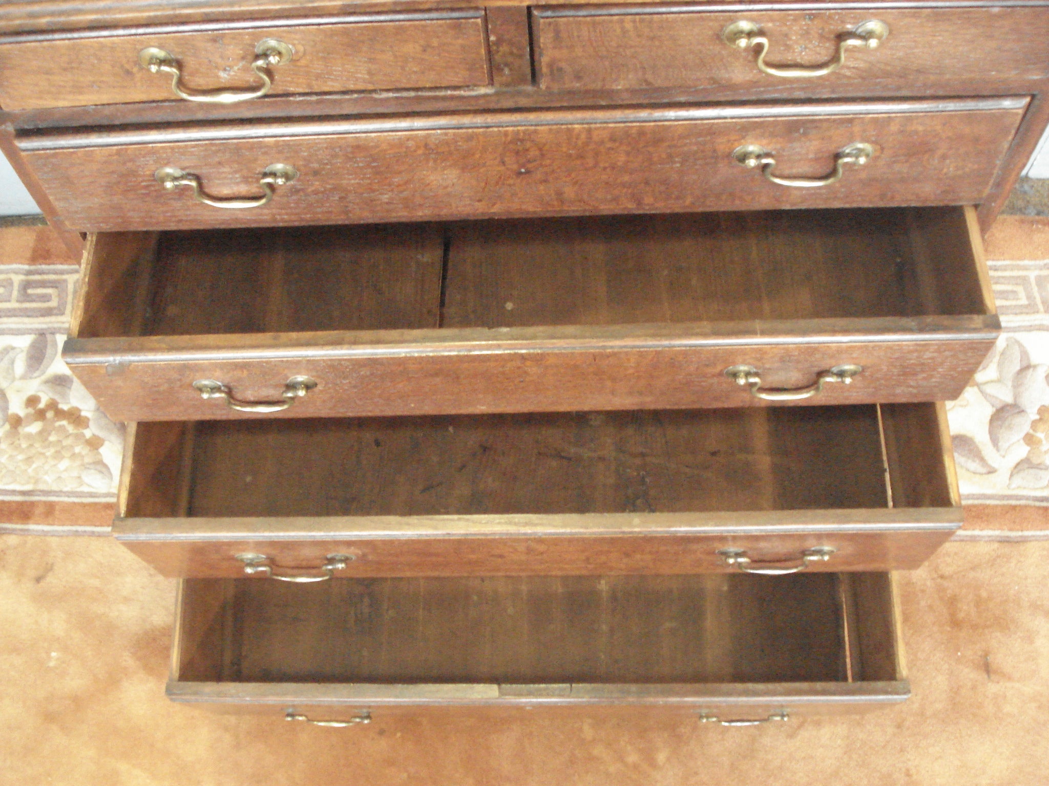 Narrow late C18th small six drawer oak chest. In its original finish.