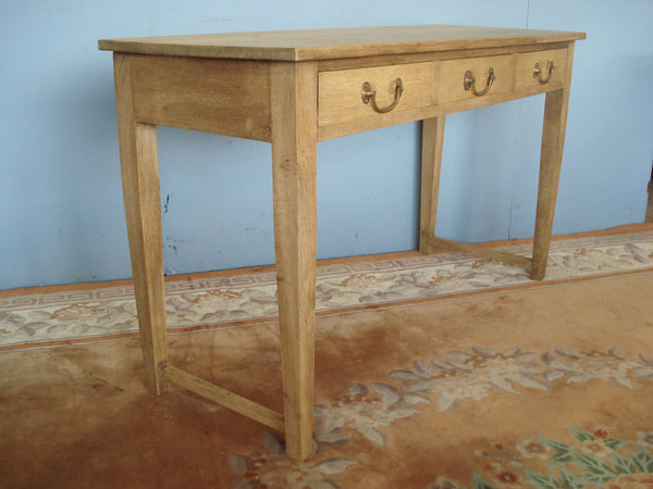 Three drawer blonde oak server / writing table