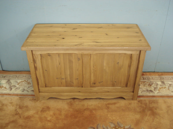 Stop end chamfered panels to this late century pine blanket chest.