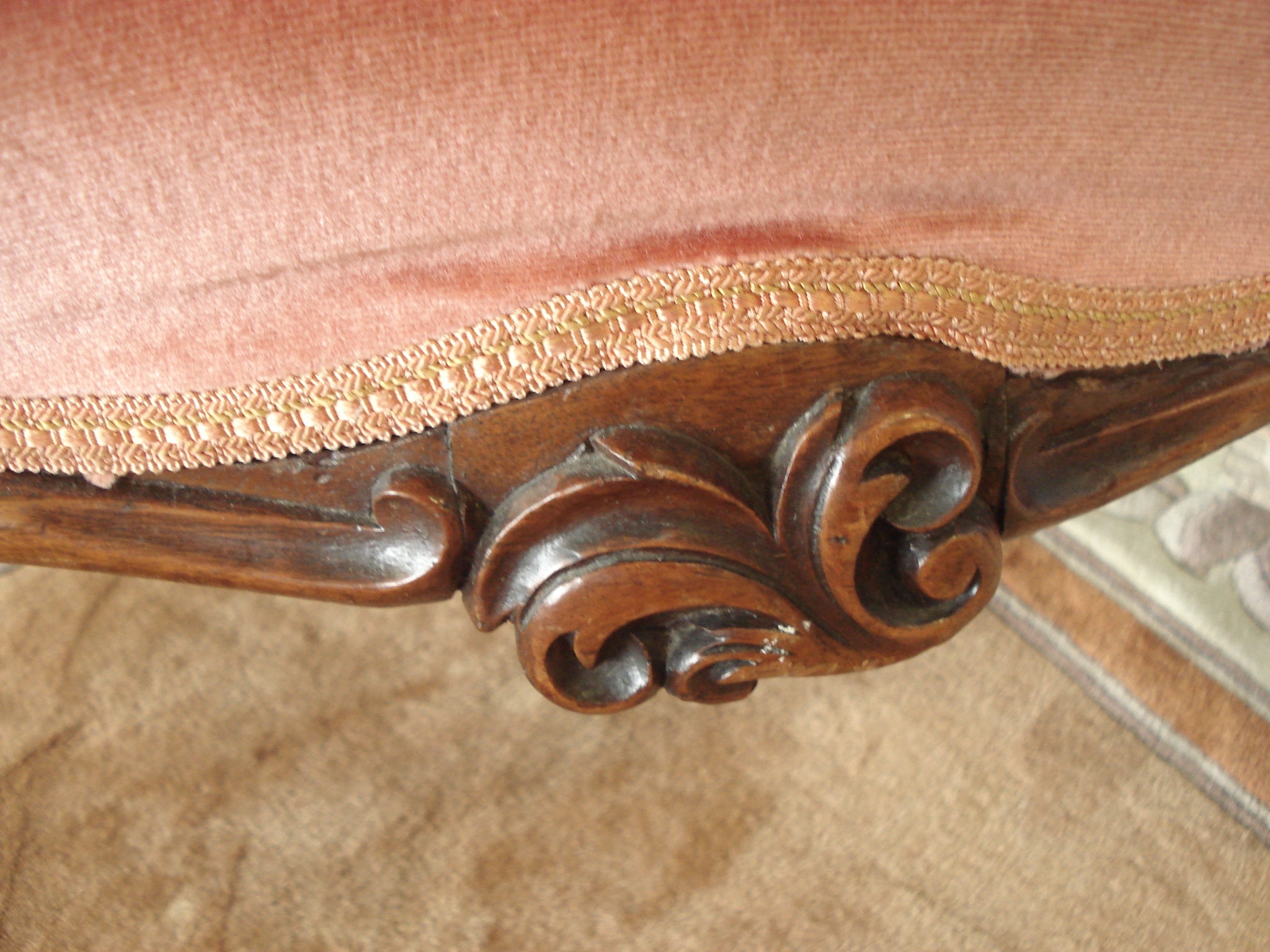 Ornately carved button back nursing chair